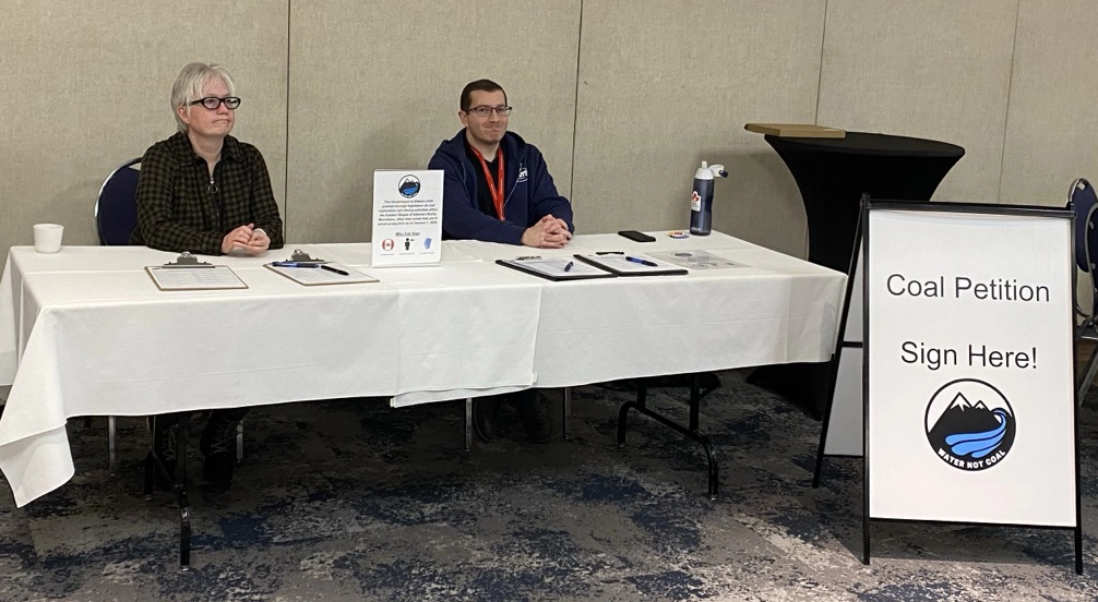 Volunteer canvassers collecting signatures for the Water Not Coal petition at a community event