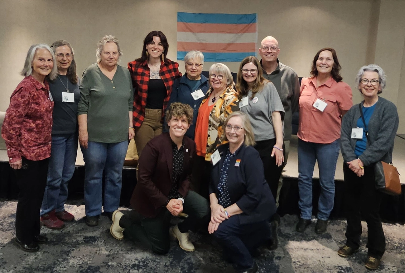 Group photo of attendees and speakers at a community dialogue event in St. Albert
