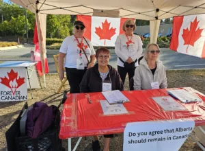 Canvassers at a Forever Canadian petition table at the St. Albert Farmers’ Market.